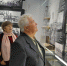 Габов Валентин Афанасьевич рассматривает фотографию легендарной буровой бригады Урусова С.Н. - Музей истории города Урай